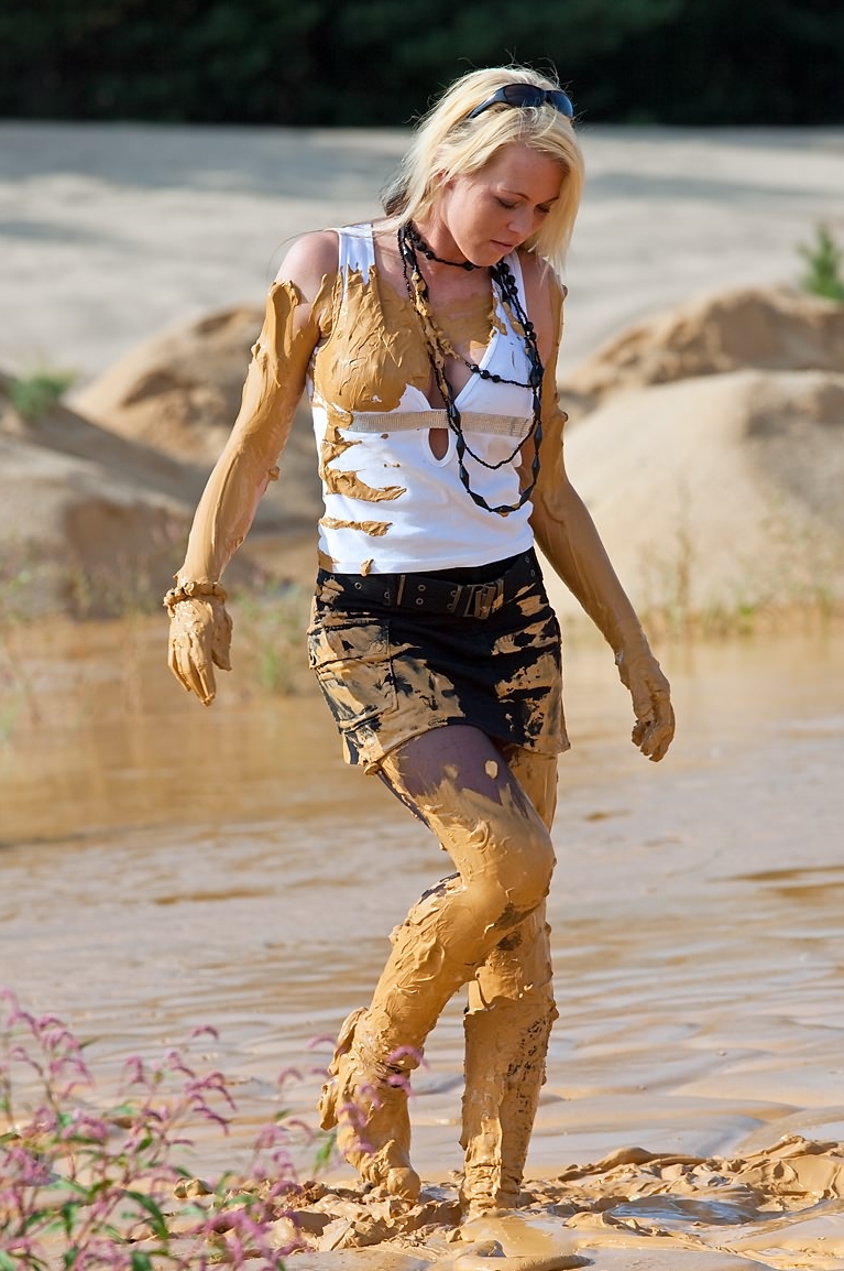 Blonde Messy Woman wearing Muddy Black Sheer Pantyhose and Black Miniskirt